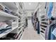 Spacious walk-in closet with custom shelving for optimal organization and storage at 12539 Wetmore Ct, Odessa, FL 33556