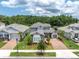 Stunning two-story home with a well-manicured lawn, brick driveway, and lush landscaping at 12539 Wetmore Ct, Odessa, FL 33556