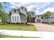 Beautiful two-story home with manicured lawn, landscaping, and a brick driveway at 12539 Wetmore Ct, Odessa, FL 33556