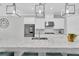 This modern kitchen features stone countertops, stainless steel appliances and white cabinets at 12539 Wetmore Ct, Odessa, FL 33556