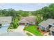Aerial view of a charming neighborhood showcasing well-kept homes, green lawns, and mature trees in a suburban setting at 13039 Topflite Ct, Hudson, FL 34669