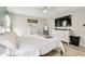 Cozy bedroom with a comfortable bed, soft rug, TV, and plenty of storage at 13039 Topflite Ct, Hudson, FL 34669