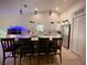 Stylish open kitchen featuring a spacious island with seating, stainless steel appliances, and bright white cabinets at 13039 Topflite Ct, Hudson, FL 34669