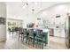 Open kitchen showcasing a large island with bar seating, stainless steel appliances, and modern finishes at 13039 Topflite Ct, Hudson, FL 34669