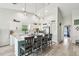 Spacious kitchen with a large island, modern appliances, white cabinets, and subway tile backsplash at 13039 Topflite Ct, Hudson, FL 34669