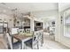 Open concept living space showcasing a dining area, kitchen, and living room with bar area at 13039 Topflite Ct, Hudson, FL 34669