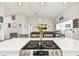 View of the Gathering room from kitchen with vaulted ceilings and a cozy atmosphere at 13039 Topflite Ct, Hudson, FL 34669