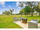 Inviting patio area featuring comfortable seating and a modern fire pit, perfect for outdoor relaxation and entertaining at 13039 Topflite Ct, Hudson, FL 34669