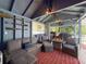 Charming cabana showcases comfortable seating, a fire pit, and an outdoor cooking area for relaxed outdoor living at 13850 Royston Bnd, Hudson, FL 34669