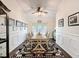 Elegant dining room featuring hardwood floors, stylish decor, and a large window for natural light at 13850 Royston Bnd, Hudson, FL 34669