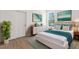 Bright bedroom featuring modern furnishings, stylish decor, and a serene, inviting atmosphere at 14042 Amero Ln, Spring Hill, FL 34609