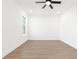 Light-filled bedroom with wood-look floors, recessed lighting, and ceiling fan at 14042 Amero Ln, Spring Hill, FL 34609