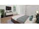 Cozy bedroom with a minimalist design, features a TV and a large window for natural light at 14042 Amero Ln, Spring Hill, FL 34609