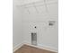 Laundry room area with washer and dryer hookups and a wire shelf at 14042 Amero Ln, Spring Hill, FL 34609