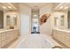 Bathroom with a large tub, double vanity, and neutral tiling at 14163 Andrew Scott Rd, Spring Hill, FL 34609