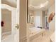 Bathroom featuring a jacuzzi tub and a walk-in shower with decorative wall tiles at 14163 Andrew Scott Rd, Spring Hill, FL 34609