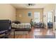 This bedroom has a ceiling fan, wood floors, a twin bed, and a mirrored closet at 14163 Andrew Scott Rd, Spring Hill, FL 34609