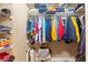 Neatly organized walk-in closet with built-in shelving and ample hanging space at 14163 Andrew Scott Rd, Spring Hill, FL 34609