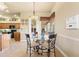 Cozy dining area featuring a glass table, ornate chairs, and natural light near the kitchen at 14163 Andrew Scott Rd, Spring Hill, FL 34609