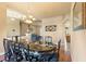 Formal dining room showcasing a chandelier, a large table with chairs, and hardwood floors at 14163 Andrew Scott Rd, Spring Hill, FL 34609
