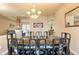 View of the formal dining room with an elegant chandelier and large table with chairs at 14163 Andrew Scott Rd, Spring Hill, FL 34609