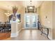 Bright foyer with tile flooring, glass double doors, and views into the living spaces at 14163 Andrew Scott Rd, Spring Hill, FL 34609