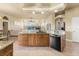 Island kitchen with granite counters overlooking the spacious living room at 14163 Andrew Scott Rd, Spring Hill, FL 34609