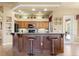Charming kitchen featuring granite countertops, tile backsplash, a breakfast bar, and wood cabinetry at 14163 Andrew Scott Rd, Spring Hill, FL 34609