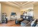 Spacious living area with coffered ceiling, wood floors and comfortable sectional sofa at 14163 Andrew Scott Rd, Spring Hill, FL 34609