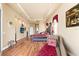 Spacious main bedroom featuring tray ceilings, hardwood floors, and stylish decor with asian accents at 14163 Andrew Scott Rd, Spring Hill, FL 34609