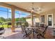 Covered patio featuring a ceiling fan, brick flooring, outdoor furniture, and backyard view with a grill at 14163 Andrew Scott Rd, Spring Hill, FL 34609