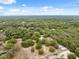An overhead view showcasing a house enveloped in lush vegetation, creating a private and tranquil setting at 14740 Loma Ave, Spring Hill, FL 34610