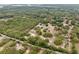A beautiful aerial view highlighting the home's peaceful, wooded surroundings and its desirable location at 14740 Loma Ave, Spring Hill, FL 34610