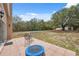 Spacious backyard featuring patio, mature trees, and above-ground pool, perfect for outdoor living and entertaining at 14740 Loma Ave, Spring Hill, FL 34610