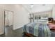 Bedroom featuring natural light, tile flooring, and a sliding glass door with a view of the pool at 14740 Loma Ave, Spring Hill, FL 34610