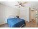 Cozy bedroom featuring a comfortable bed, closet, and a ceiling fan to keep you cool at 14740 Loma Ave, Spring Hill, FL 34610