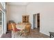 Cozy dining area with natural light and view of kitchen at 14740 Loma Ave, Spring Hill, FL 34610