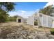View of the greenhouse and garage, offering potential for gardening and storage at 14740 Loma Ave, Spring Hill, FL 34610