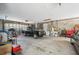 Large garage offering parking space, storage, and work area with block walls at 14740 Loma Ave, Spring Hill, FL 34610
