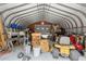 Spacious garage interior with ample storage and a lawnmower, perfect for projects at 14740 Loma Ave, Spring Hill, FL 34610
