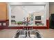 Stainless steel sink with pass-through to living area and fireplace at 14740 Loma Ave, Spring Hill, FL 34610