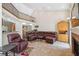 Spacious living room with fireplace, high ceilings, and views of the second story at 14740 Loma Ave, Spring Hill, FL 34610