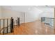 Upstairs loft area with a closet and hardwood floors, providing ample room for activities at 14740 Loma Ave, Spring Hill, FL 34610