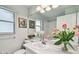 Bright bathroom featuring a vanity, mirror, and decorative accents that enhance the space at 1486 Loman Ct, Palm Harbor, FL 34683