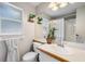 Bathroom featuring a shower-tub combo and single sink vanity with light colored walls and tile floors at 1486 Loman Ct, Palm Harbor, FL 34683