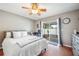 This spacious bedroom is full of natural light with sliding glass doors to the outside patio at 1486 Loman Ct, Palm Harbor, FL 34683