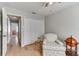 Bedroom with wood floors and closet featuring a door to another room at 1486 Loman Ct, Palm Harbor, FL 34683