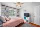 Comfortable bedroom features large built-ins and plenty of natural light at 1486 Loman Ct, Palm Harbor, FL 34683