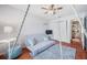 Bedroom with a daybed-style sofa, a hanging chair, and a plush rug at 1486 Loman Ct, Palm Harbor, FL 34683