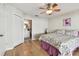 A bedroom with a closet, access to screened in patio and bathroom at 1486 Loman Ct, Palm Harbor, FL 34683